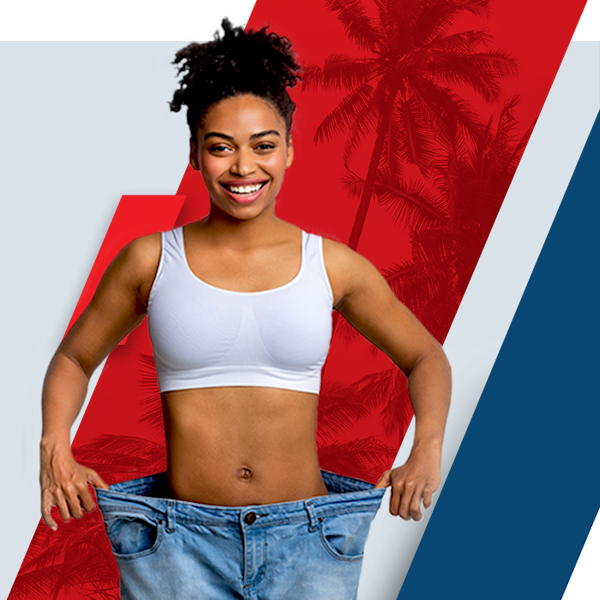 Bariatric patient showing weight loss results with too-large jeans