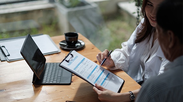 Patient and provider discussing care costs